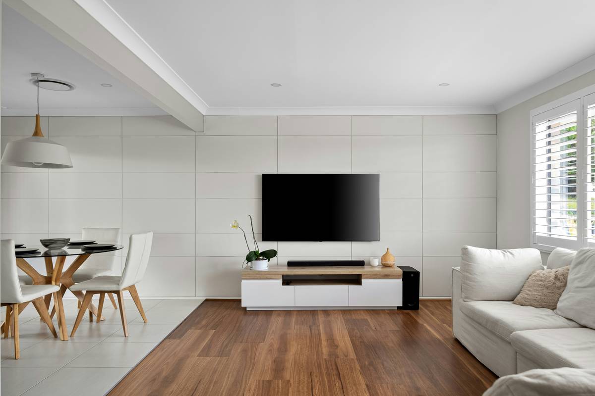 Infographic showing key digital signage program benefits: mood enhancement (+42% reported relaxation), clutter reduction (-60% physical decor items), energy efficiency (up to 30% savings vs traditional lighting), and resale value boost