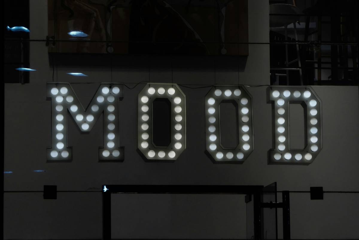 g digital signage pricing displayed on a modern high-tech bathroom mirror with ambient lighting